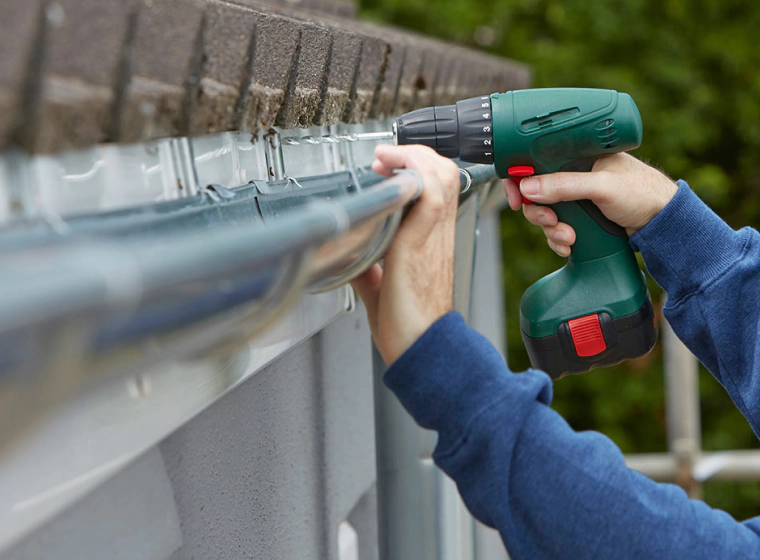 fixing a damaged gutter